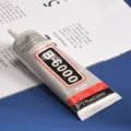 Close-up van de Suxun B-6000 multi-purpose knutselijm tube met details en specificaties. - B6000 lijm 110 ml