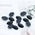 Primer plano de ojos de muñeca ovalados negros planos para proyectos de manualidades DIY. - 13x19mm 50 Piezas/Paquete / Negro