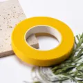 Detail shot of yellow floral paper tape for DIY crafts, florist stem wrapping and bouquet making. - Golden Yellow