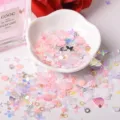 Close-up of mixed holographic nail sequins, star and shell glitter flakes for DIY crafts. - Korean Style 4