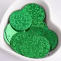 Detail view green holographic round sequins for DIY sewing crafts 25mm garment trimmings - Laser Green