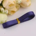 Dark purple satin ribbon roll variant for DIY crafts, gift wrapping, and decorative bows. - Ink Blue