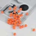 Orange 6mm acrylic imitation pearl beads for DIY jewelry making bracelets and crafts. - 100 Pieces/Pack / Orange