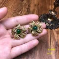 Detailed view of vintage retro earrings featuring a green gemstone inlay and elegant design. - Green Agate Stud Earrings