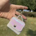 Mini sequin bag keychain charm and earphone pouch held in hand with glittery finish - Bag Charm / Flat Embroidered Light Pink