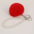 Rode zachte pompon parel polsband sleutelhanger tas bedel schattige pluche accessoire. - Rode pompon-parelsleutelhanger