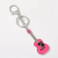 Detailed view of the cute pink guitar metal keychain, compact size and polished finish. - Deep Pink