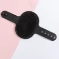 Silicone pet grooming brush for dogs and cats, gentle bath massage brush for loose hair. - Black