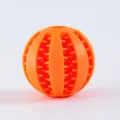 Orange silicone dog chew toy ball, durable interactive pet treat dispensing molar ball SKU. - Orange