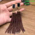 Pendientes largos vintage de borla de cristal con brillantes pedrerías y piedras negras. - Marrón
