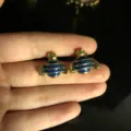 Enamel bee stud earrings close-up view showing delicate gold-plated details and blue pattern. - Bee Stud Earrings / Blue