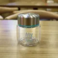 Mini glass cup with metal lid and teal ring variant, portable clear tea cup for daily use. - Blue