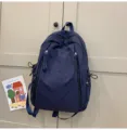 Casual nylon backpack for daily school travel, lightweight and waterproof campus bag for women. - Dark Blue
