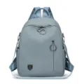 Sac à dos femme bleu clair chic pour le voyage et l'école avec fermetures éclair rondes. - Bleu