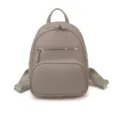 Sac à dos élégant pour femme en cuir gris taupe avec poches zippées et bretelles réglables. - Gris