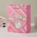 Pink paper gift bag with beautiful bow pattern for party candy shopping packaging - 18x10x23cm / Pink
