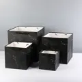 Detailed view of square marble paper gift bags with black handles and thick wide bottom. - Black Marble