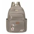 Sac à dos en nylon gris décontracté avec élégante broderie florale et poches zippées pratiques. - Kaki