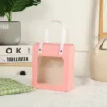 Pink paper window gift bag with white ribbon handles for wedding party birthday celebrations. - Pink