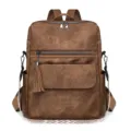 Sac à dos vintage marron pour femme en cuir avec pompon et sangle à motif élégant. - Marron
