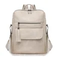 Fashionable women's soft leather backpack with tassel detail and chic patterned straps, beige. - Off White