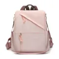 Sac à dos anti-vol rose élégant pour femme avec poches zippées pour voyage quotidien. - Rose
