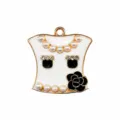 Metal shoe charm detail featuring pearls, rhinestones, and elegant black camellia flower design. - Black Camellia Pearl
