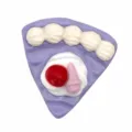 Close-up view of cute purple cake shoe charm, 3D PVC clog accessory detail display. - 323-04