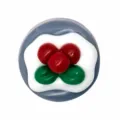 Detailed view of 3D PVC cake shoe charm accessory, cute red berry design for garden clogs. - 323-09