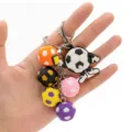 Cute 3D cartoon soccer ball keychain with colorful pendants and metal lobster clasp for bags. - Referee Style