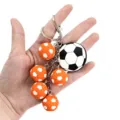 3D soccer keychain with multiple mini orange footballs and keyring pendant for bags. - Orange Soccer Style