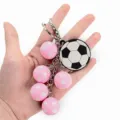 Cute 3D pink and black soccer ball keychain with metal ring for women and bag charm - Pink Soccer Style