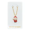 Close-up detail van de strass Kerstman hanger op een gouden kogelketting met kaart. - Kerstman