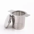 Stainless steel tea strainer detail featuring fine mesh, dual handles, and lid for tea. - Tea Strainer (No Silicone)