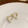 Exquisite gold hoop earrings detailed with dense tiny white pearls for elegant fashion styling. - Heart-Shaped Hoop / Gold