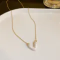 Gold chain necklace with pearlescent heart pendant, minimalist fashion jewelry detail shot. - Gold Pink Heart Style (122#)