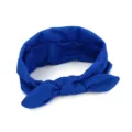 Detailed close-up shot of the royal blue fabric headband with a cute knotted bow design. - Sapphire Blue
