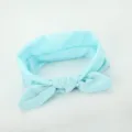 Detail shot of light blue fabric hair band, showing soft texture and cute bow knot design. - Light Blue