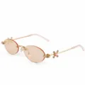 Chic rimless oval metal sunglasses for women, featuring gold frames and light orange lenses. - BQ8120 Gold Frame Light Orange Lenses