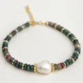 Close-up of natural Indian agate and freshwater pearl beaded bracelet with golden metal spacers. - Indian Agate Freshwater Pearl Bracelet / Multicolor