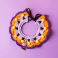Halloween pet knitted bib detail showing purple orange yarn pom poms and cute witch pendant - 3D Little Ghost