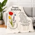 Detailed shot of flannel birthday throw blanket with floral design and warm blessing quotes. - 70X100cm