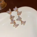Lange goldene Zirkonia-Quasten-Ohrstecker mit Schmetterlingen, eleganter koreanischer Stil. - Strass Schmetterling Stil (5#) / Gold