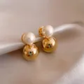 Elegant double ball earrings featuring a shiny gold sphere and a classic white pearl design. - Double Ball Pearl (133#)