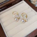 Elegant French retro pearl hoop earrings with delicate white flower charms for sweet daily wear. - No 12 Gold Pearl Flower
