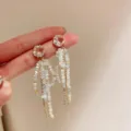 Eleganti orecchini lunghi con perline di cristallo e design brillante per look alla moda. - Fiocco Oro (43#)