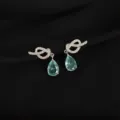 Detail view of crystal knot drop earrings with light blue gem closeup feature elegance. - Rhinestone Waterdrop Knot Style