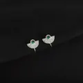Close-up detail of silver clip-on earrings with green gem and fan-shaped textured design. - Rhinestone Fan Style