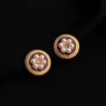 Close-up detail of retro wine red enamel pearl clip-on earrings with gold-tone finish. - Wine Red Little White Flower Mosquito Coil Clip
