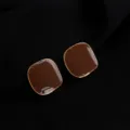 Detail shot of retro dark red geometric enamel clip-on earrings with gold-plated trim. - Wine Red Red Brown Square Mosquito Coil Clip